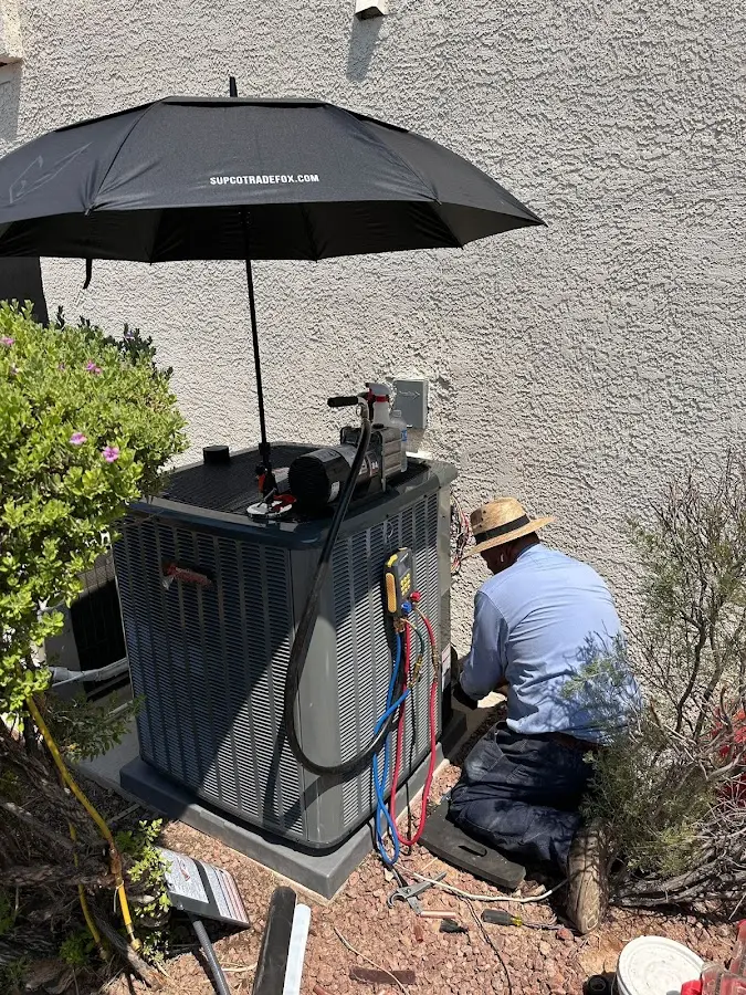 HVAC technician performing outdoor AC maintenance in Bethany